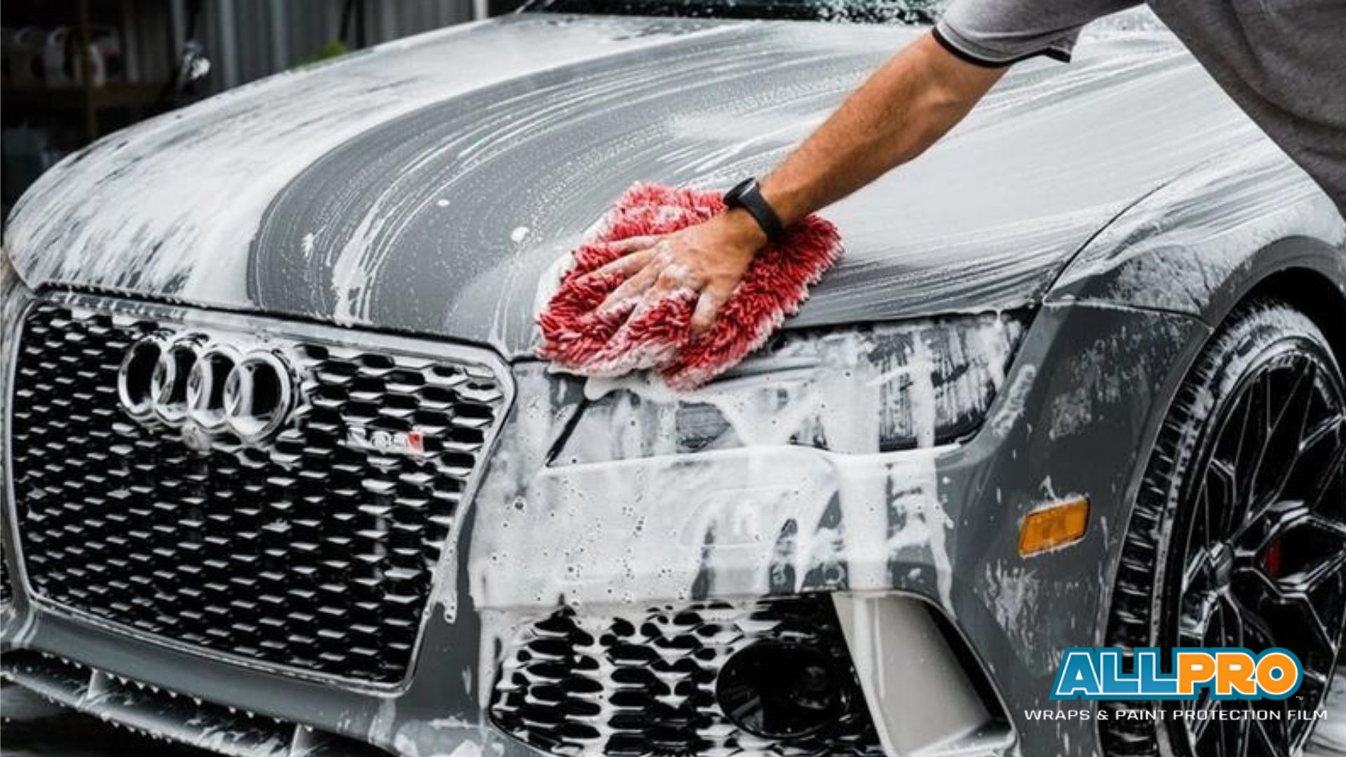 Car receiving a professional hand wash at All Pro Wraps in Raleigh