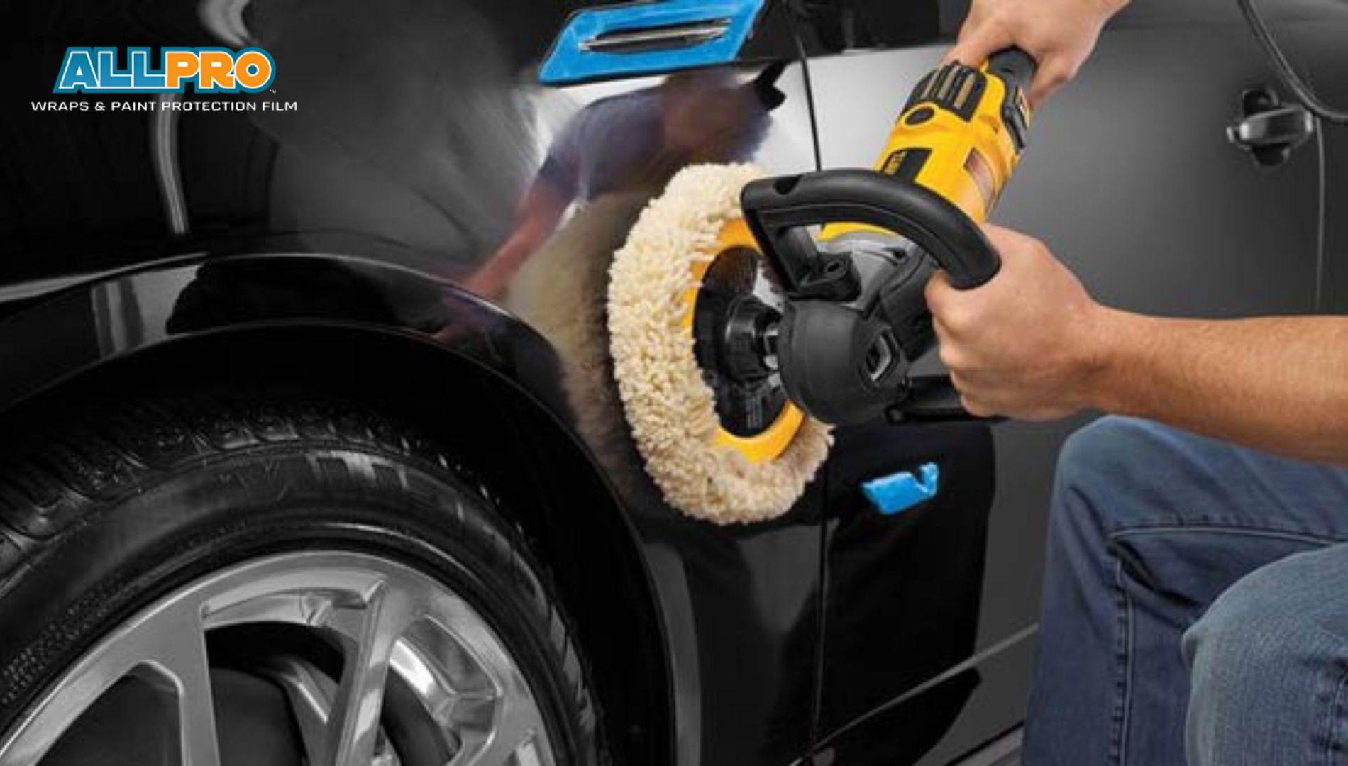 A person uses a yellow power buffer to polish the side of a black car, creating a glossy finish on the paint. The logo reads "ALL PRO WRAPS & PAINT PROTECTION FILM" in the top corner.
